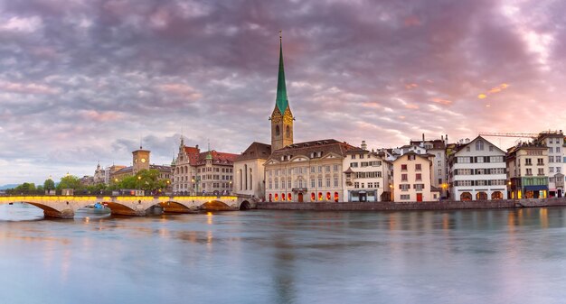 Famous fraumunster church and river limmat at sunrise in old town of zurich switzerland