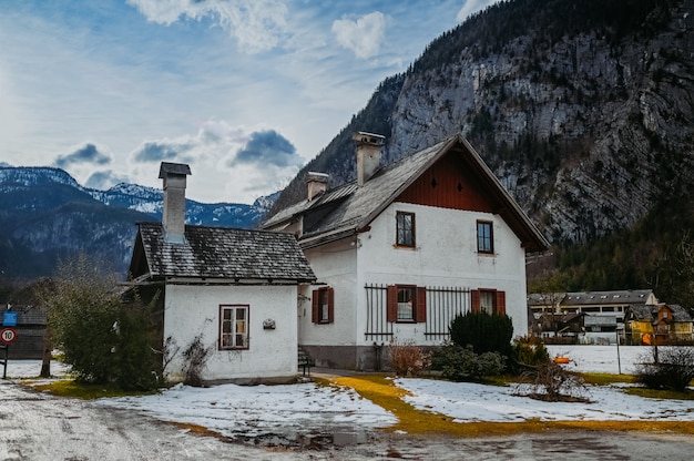 Famous Hallstatt mountain village and alpine lake landscape