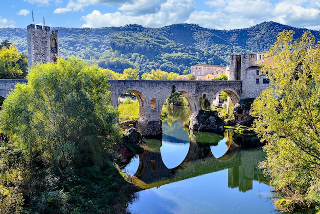 Famous medieval bridge over the river Fluvia in the medieval village de Besal, Girona, Catalonia.