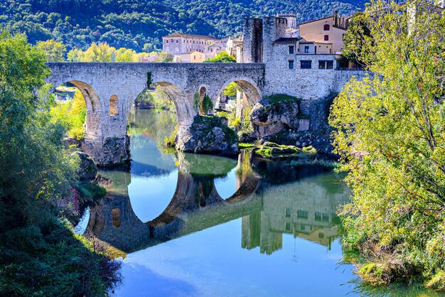 Famous medieval bridge over the river fluvia in the medieval village de besal, girona, catalonia.