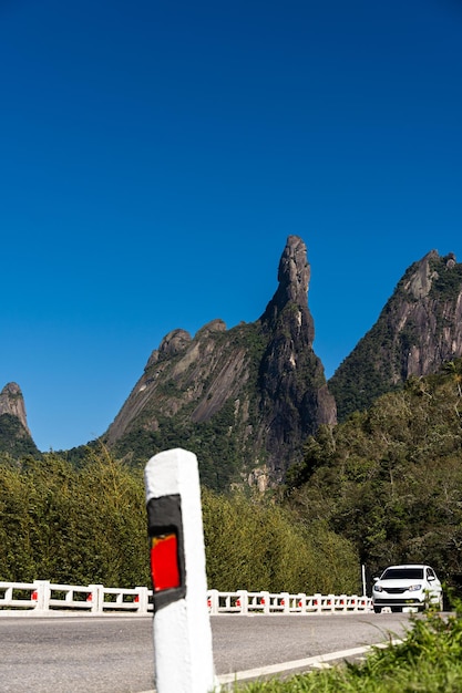 Famous mountain surrounded by hills located in the Teresopolis mountain range in Rio de Janeiro Brazil known as Dedo de Deus Dedo de Deus Sunny day