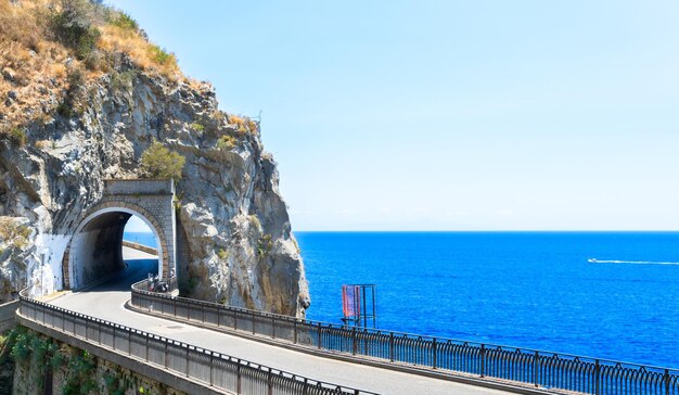 Famous picturesque road viaduct of Amalfi summer coast with sea water Italy web banner format