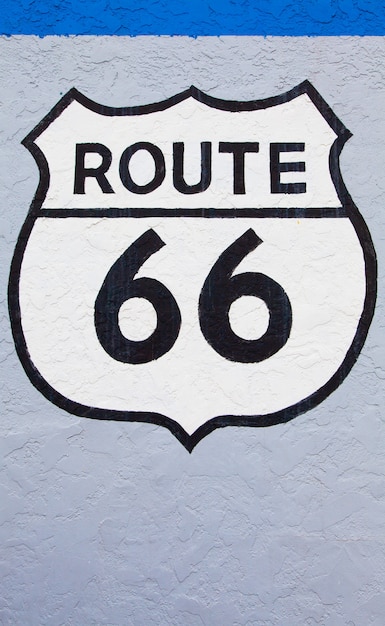 Famous streetsight of Route 66 painted on a wall in Flagstaff