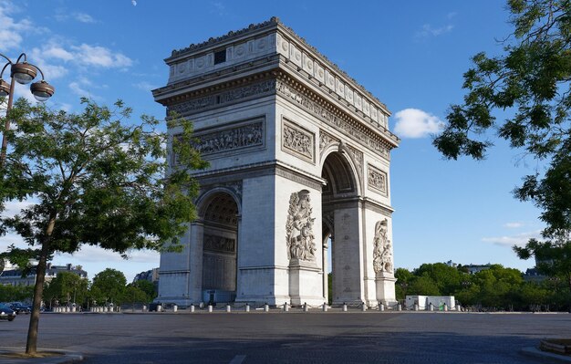 the famous triumphal arch at sunny day paris france