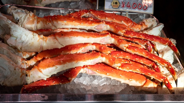 The famous Tsukiji fish market with retail shops sale crab legs and seafood in Tokyo. Outer market, a largest wholesale seafood market in the world