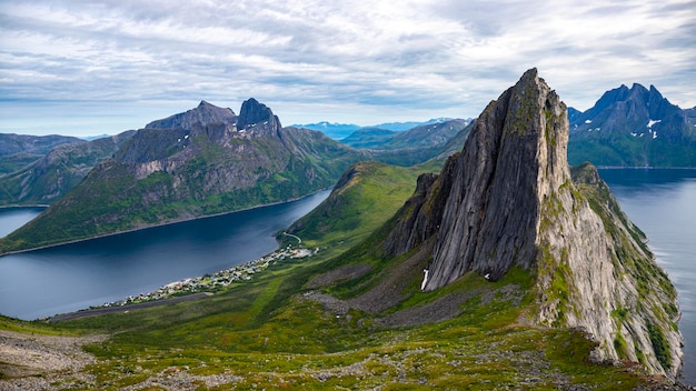 famous view of mountain segla with panoramic view of the town of fjordegar, senja, norway