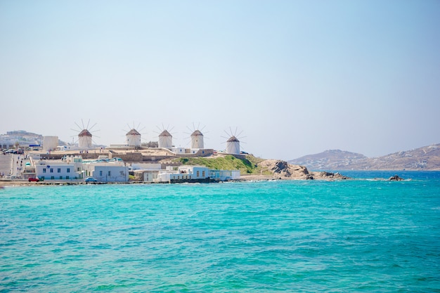 Famous view of traditional greek windmills on Mykonos island at sunrise, Cyclades, Greece