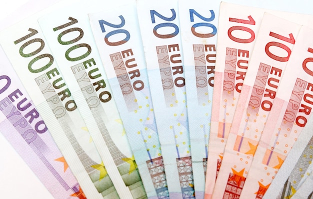 A fan of euro banknotes is shown.