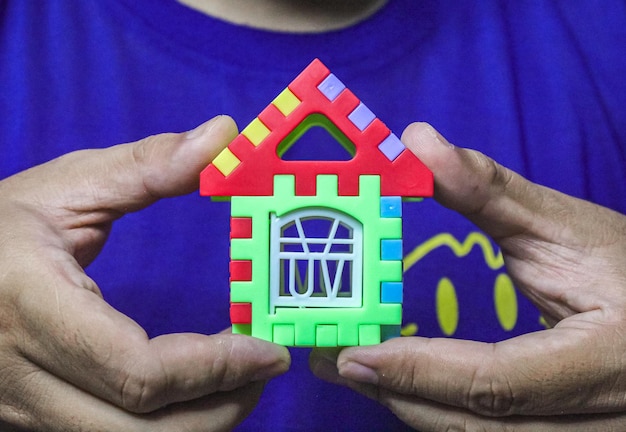 Fancy block house toy in hand