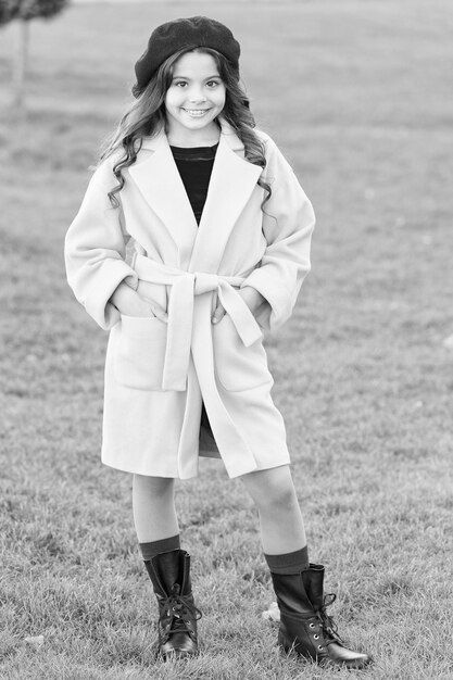 Fancy coat Classic coat does not have to be boring but sticking to scale of warm understated tones Girl fashionable model wear yellow wool coat Child in warm clothes Feeling cozy and comfortable