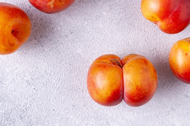 Fancyshaped plum on white plaster