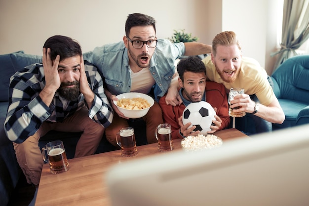 Fans of soccer watching match