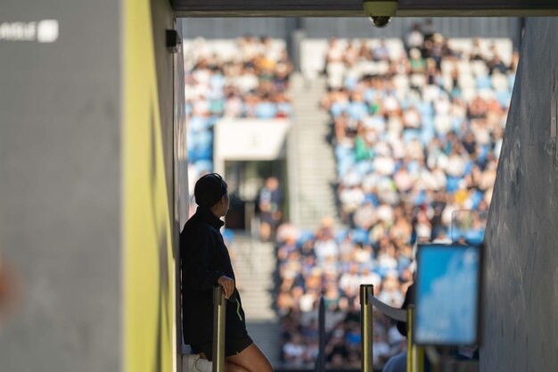 Foto fan che guardano una partita sportiva e un evento sportivo in uno stadio