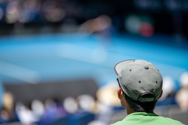 Fans watching a sporting match and sporting event in a stadium