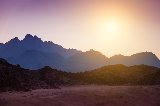 Fantastic landscape with mountains at sunset. Arabian desert, Egypt. Beautiful nature. Creative toning effect