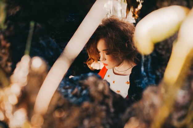 Fantastic redhead girl in a mysterious forest