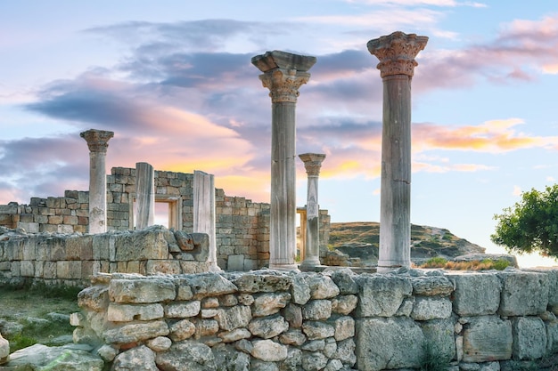 Fantastic sunset over ruins of the basilica in ancient city chersonese national historical and archaeological reserve