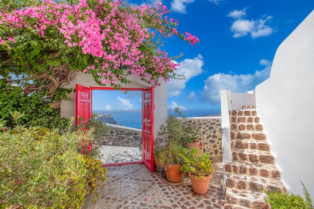 Fantastic travel background Santorini urban landscape. Red door entrance stairs Mediterranean sea