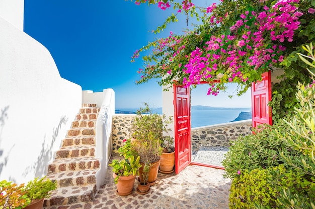 Fantastic travel background, Santorini urban landscape. Red door or gate with stairs romantic travel
