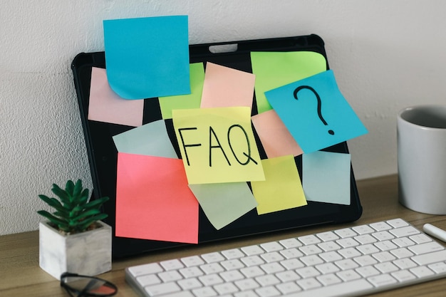 Photo faq or frequently asked question text on sticky notes