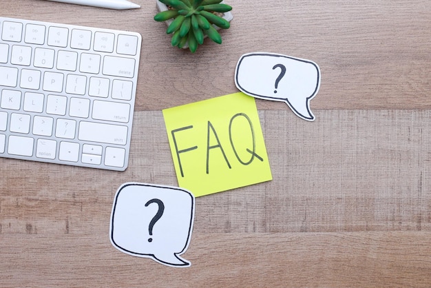 Photo faq or frequently asked question on wooden office desk