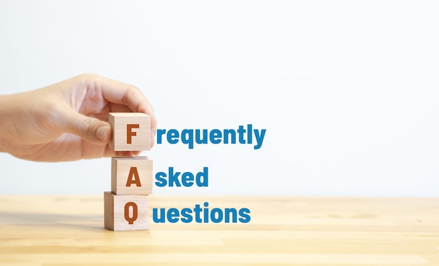 FAQ ,frequently asked questions concepts with text on wood