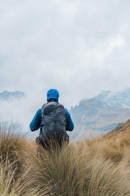 Far view of hiker walking with backpack downhill in iztaccihuatlpopocatepetl Valley