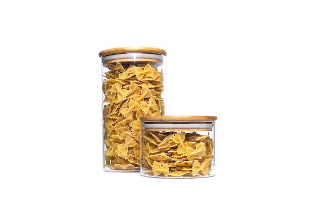 Farfalle in a glass jar isolated.