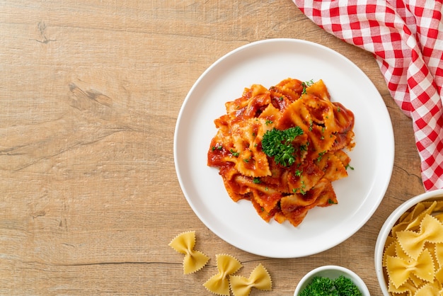 farfalle pasta in tomato sauce with parsley - Italian food style