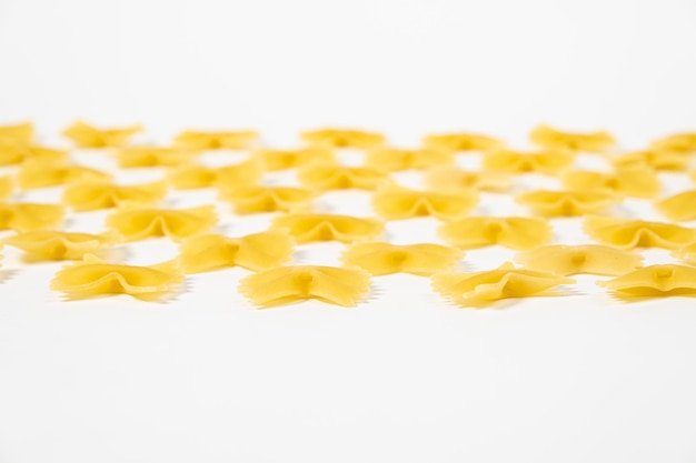 Farfalle pasta on white background