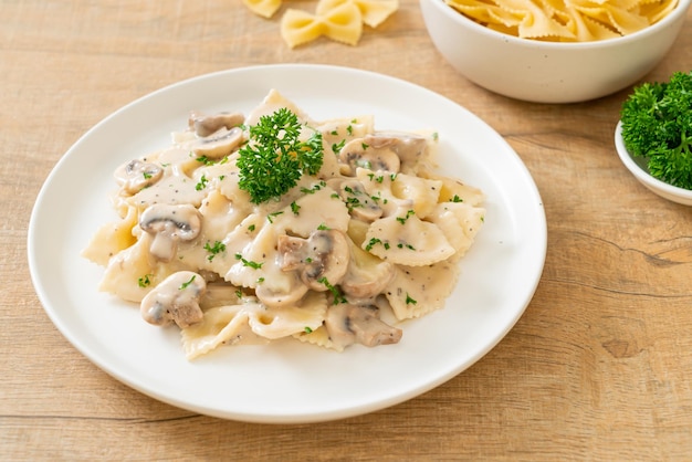 farfalle pasta with mushroom white cream sauce - Italian food style