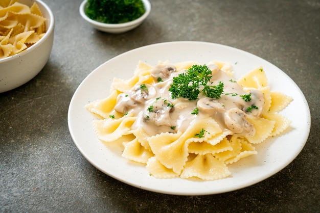 farfalle pasta with mushroom white cream sauce - Italian food style