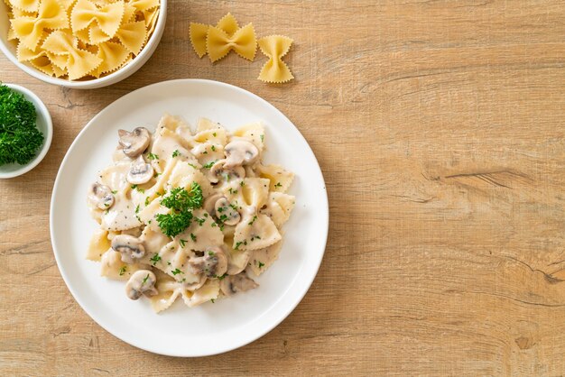 farfalle pasta with mushroom white cream sauce - Italian food style