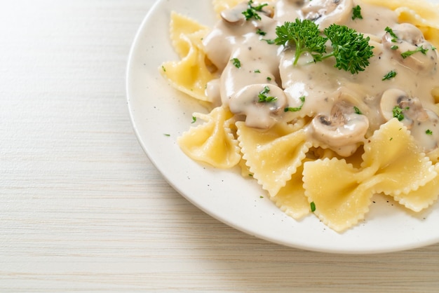 farfalle pasta with mushroom white cream sauce - Italian food style