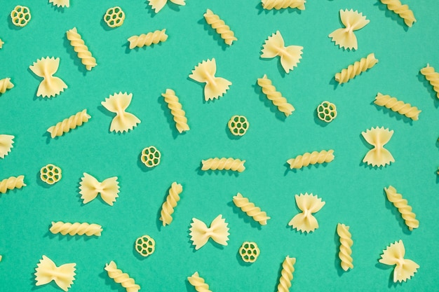 Farfalle, rotelle and fusilli pasta flat lay