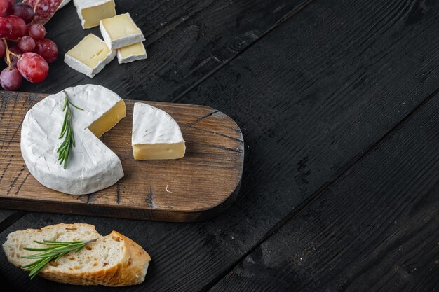 Farm cheese camembert set, on black wooden table