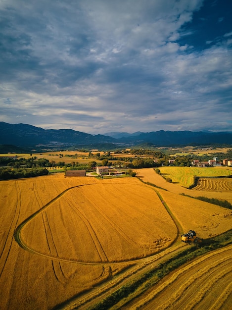 A farm in the countryside with a cloudy sky