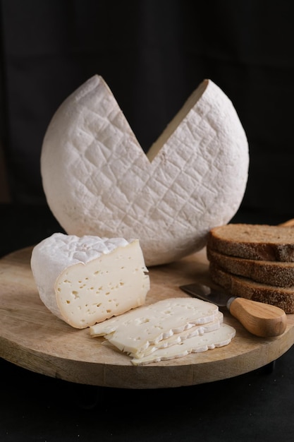 Farm french cheese Saint Paulin. French dessert cheese