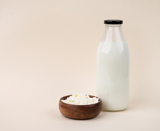 Farm milk in bottle and cottage cheese The concept of healthy and dietary nutrition Fermented product Copy space