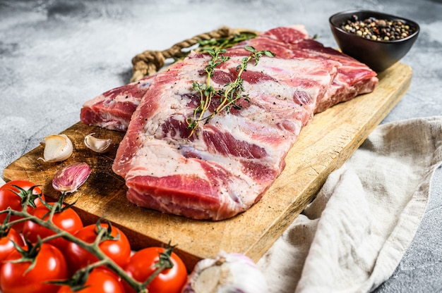 Farm organic meat. Raw pork ribs with rosemary, pepper and garlic. 