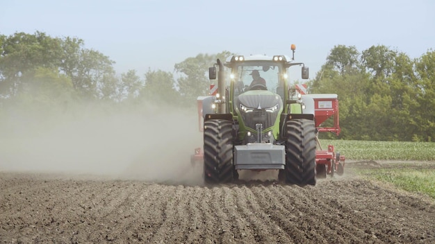 Farm tractor moving on agricultural field Agricultural equipment