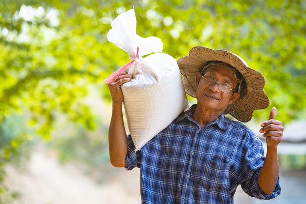 Farmer Asian with white sack