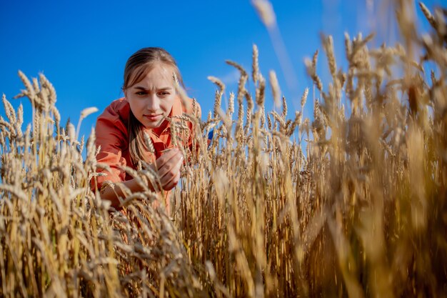 Farmer checking wheat field progress