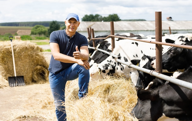 Farmer at farm with dairy cows