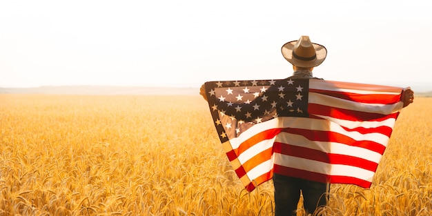 Farmer holding the American flag