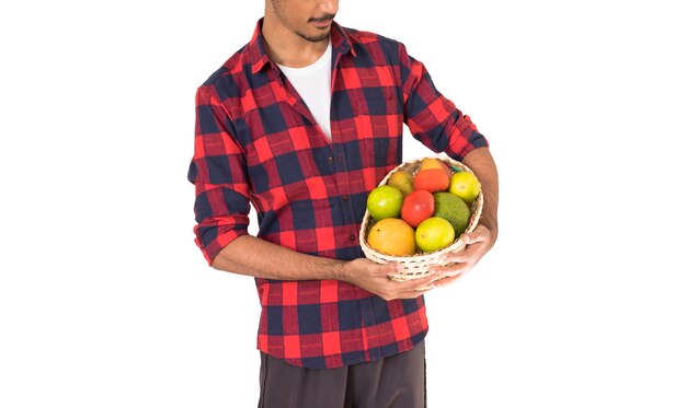 farmer holding a basket of fruits