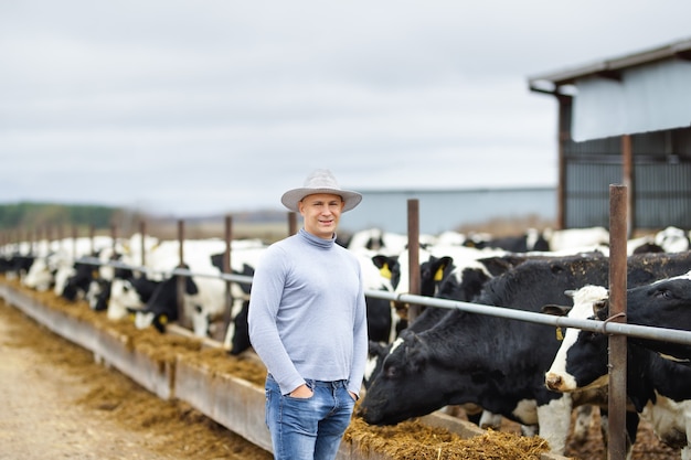 Farmer portrait of farm cows