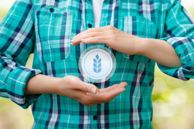 Farmer protects the harvest icon on blurred background