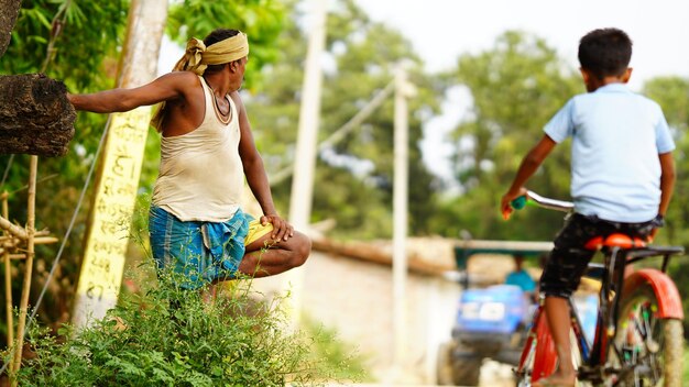 Farmer standing road side image