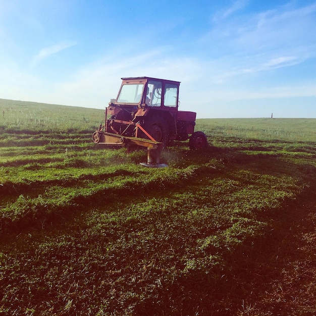 Farmer in tractor plowing field